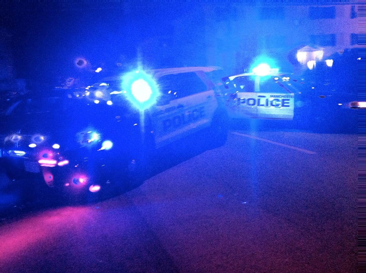 Police cars block Beech Street following a shooting Wednesday night.