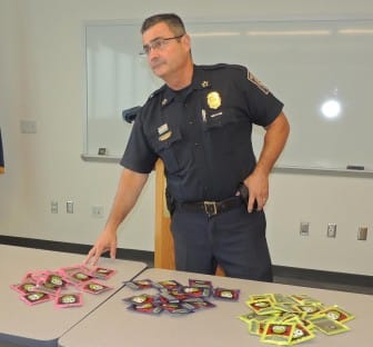 Chief David Mara stands beside a table of confiscated "spice."
