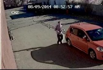 Surviellance photo of alleged pizza shop robber.