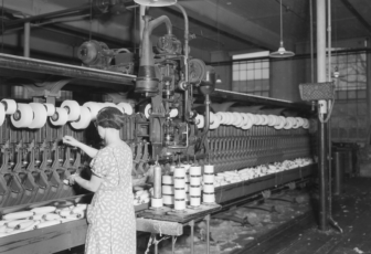 Pacific Mills. Woman does work of 4 with hand-tying machine. 1937