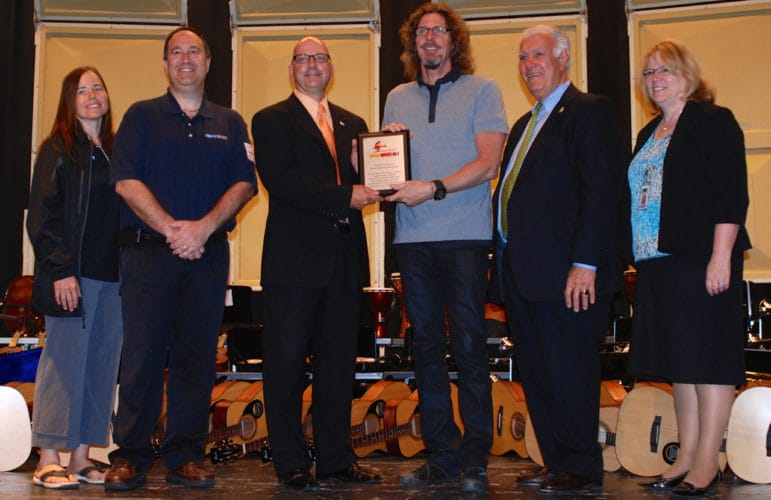 Maureen and Todd Berkowitz of Manchester Subaru; Tim Russell, representing Manchester music educators; Ernie Boch Jr.; Mayor Ted Gatsas; and Superintendent of Schools Debra Livingston at the Music Drives Us Foundation presentation to Manchester School District .