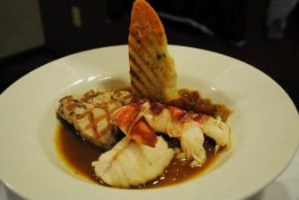 Classical French Cuisine menu: Braised monkfish, grilled tuna, and lobster Bouillabaisse