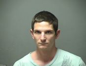 Thief with $12 wine bottle restrained by customer after tussling with clerks