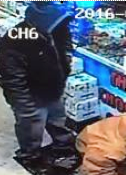 Armed robber as seen at Shawn's Corner Market Tuesday night, via surveillance footage.