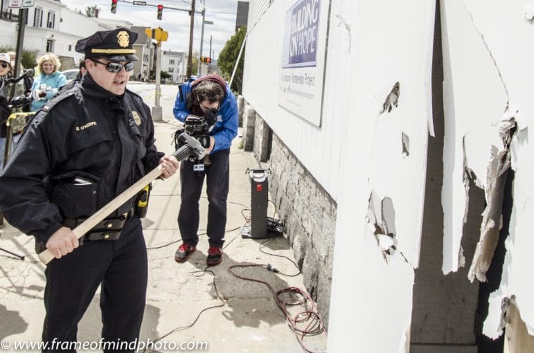 Lt. Brian O'Keefe taekes a turn with the sledgehammer.