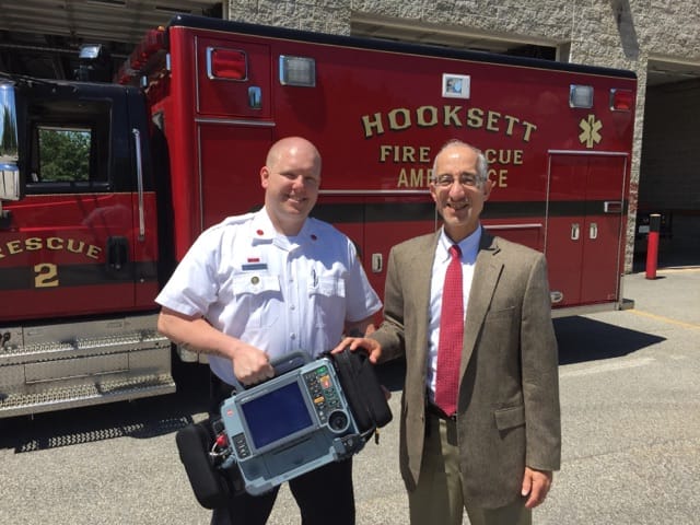Hooksett firefighter/critical care paramedic Joseph Stalker (L) and Louis Fink, MD, Medical Director of the New England Heart and Vascular Institute at CMC pose with the LIFEPAK 15 monitor/defibrillator donated to the department June 17.