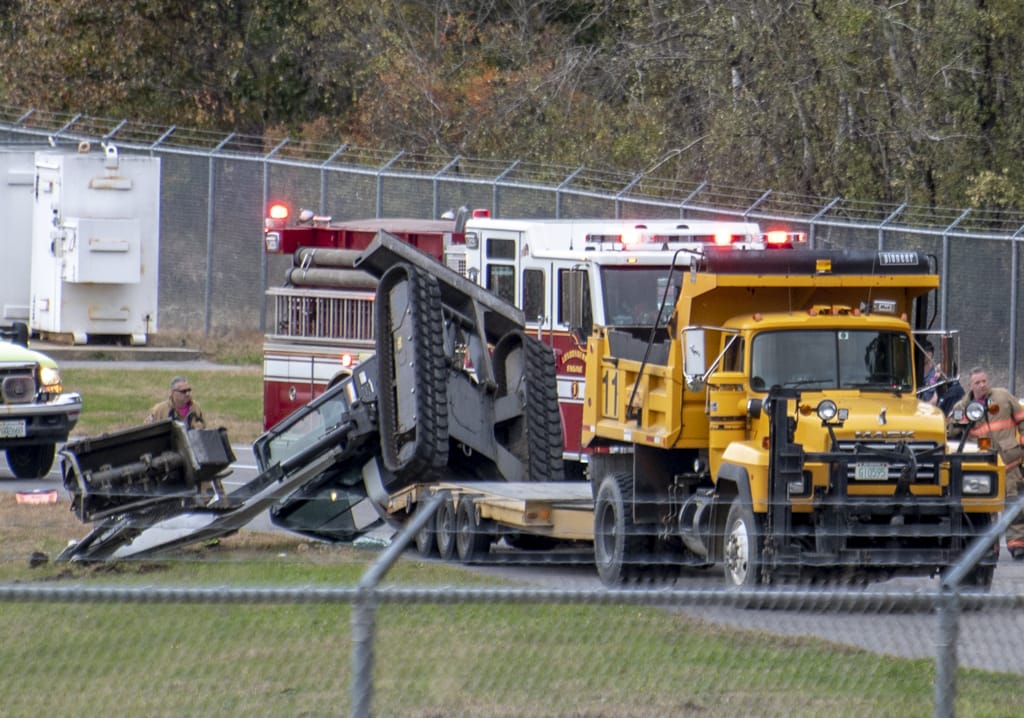 Operator trapped after excavator roll over at airport