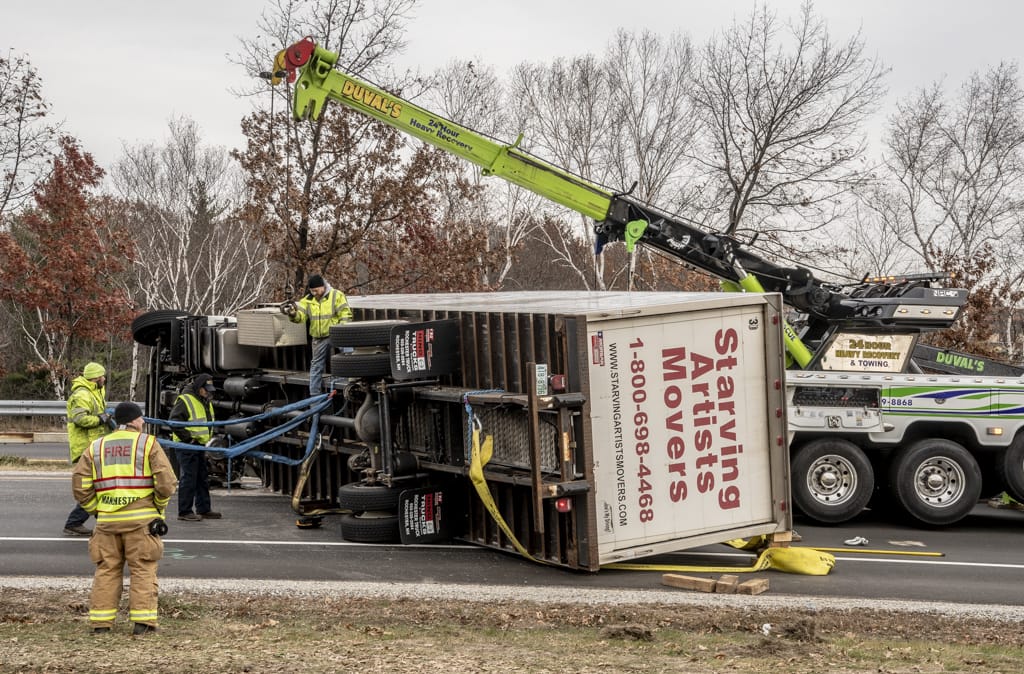 Box truck rollover ties up morning commute on I-293