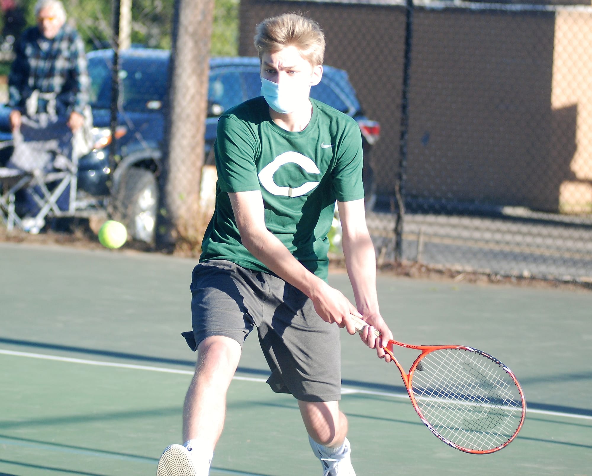 Jimmy Gilroy playing tennis.