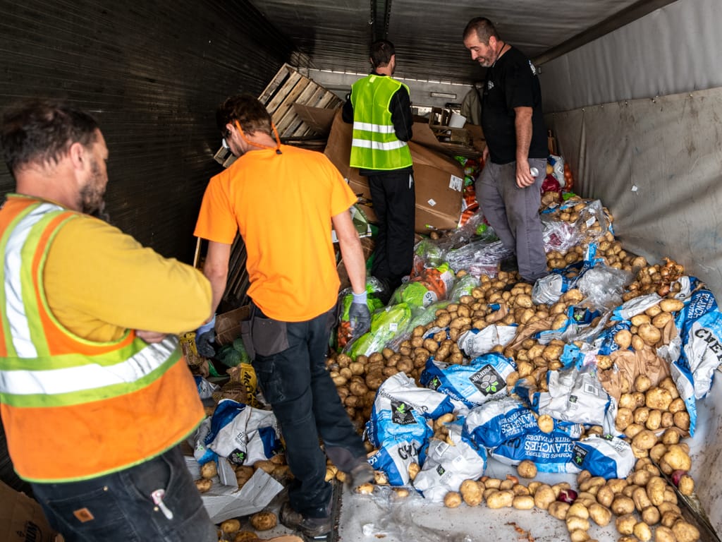 Truck-load of produce overturns on I-93, shuts down southbound lane overnight