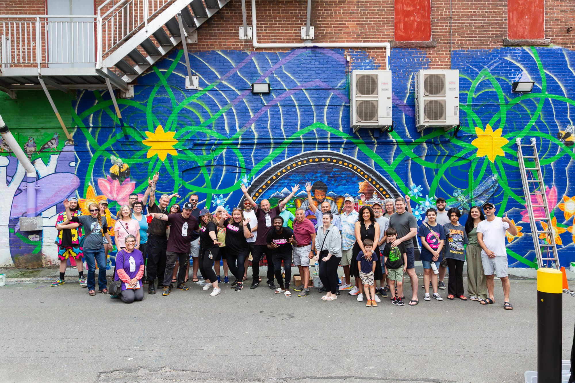Arts Build Community needs you: Help make the 2025 Community Canvas Mural Festival happen