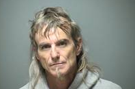 Man wanted in Texas found by police sleeping on bench post image