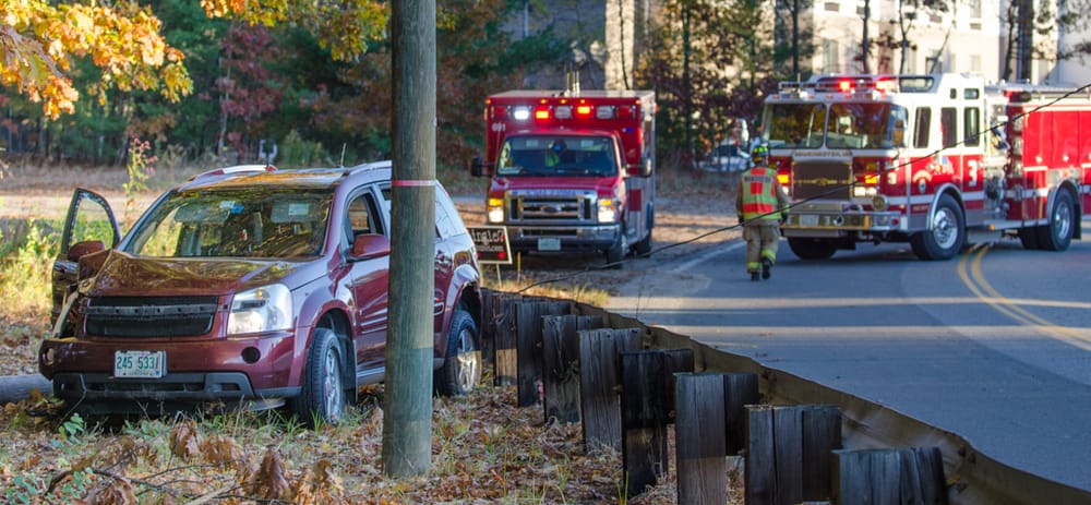 Occupants trapped by live wire after car veers off road, snaps utility pole post image