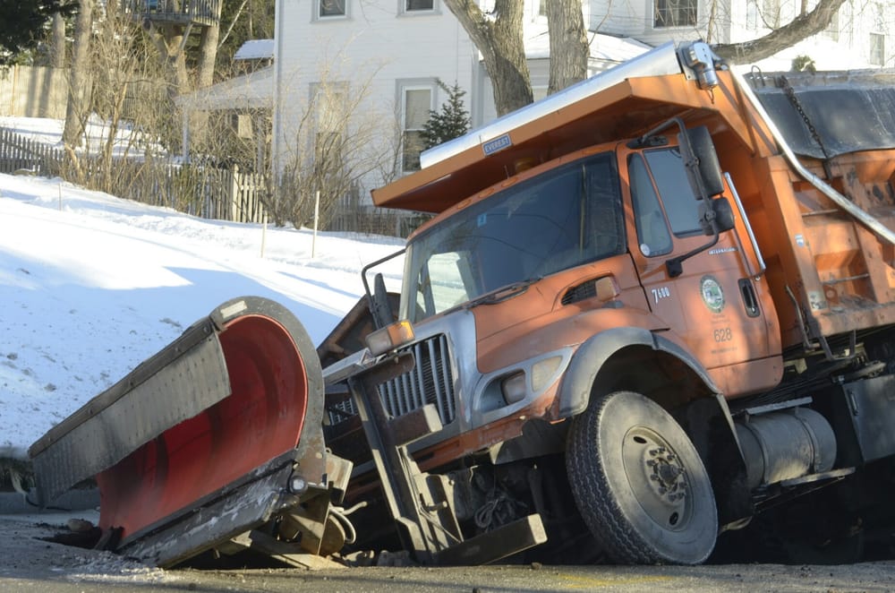 City truck falls into sinkhole following water main break post image