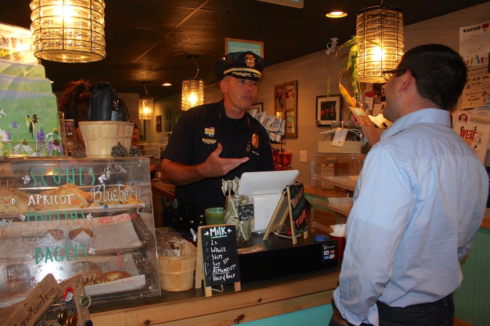 Conversation and coffee flowed during  ‘Coffee with a Cop’ event at Cafe la Reine post image