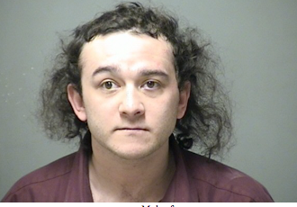 Disorderly hotel guest locks self in car, backs into vehicle, nearly runs down cops post image