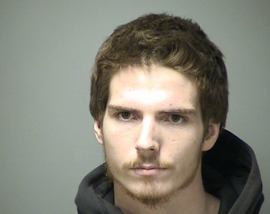 Passenger charged with heroin possession after driver runs red light post image
