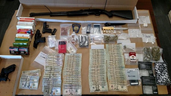 Manchester SWAT seizes drugs, guns and cash in early morning raid post image