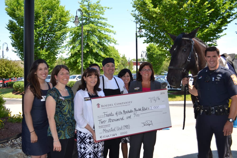 Horse sense: Hilton Garden Inn donates to Manchester Police Mounted Unit post image