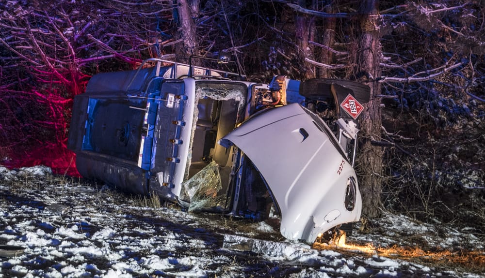 Diesel truck loses control on I-93, careens off highway, crashes into trees post image