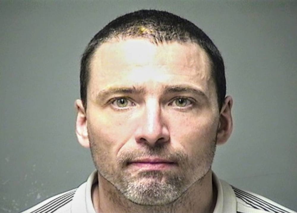 Man charged with bank robbery after clues found at cemetery post image