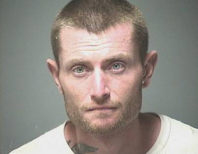 Man arrested for criminal mischief after throwing rock through bank window post image