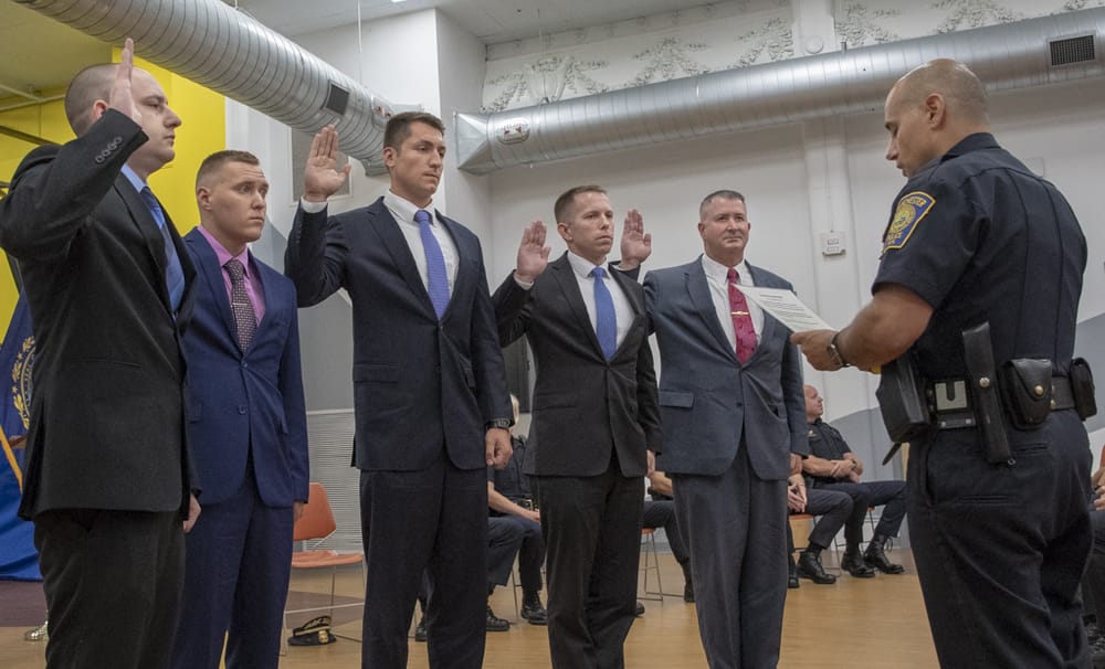 5 promotions and 5 new police officers sworn in post image