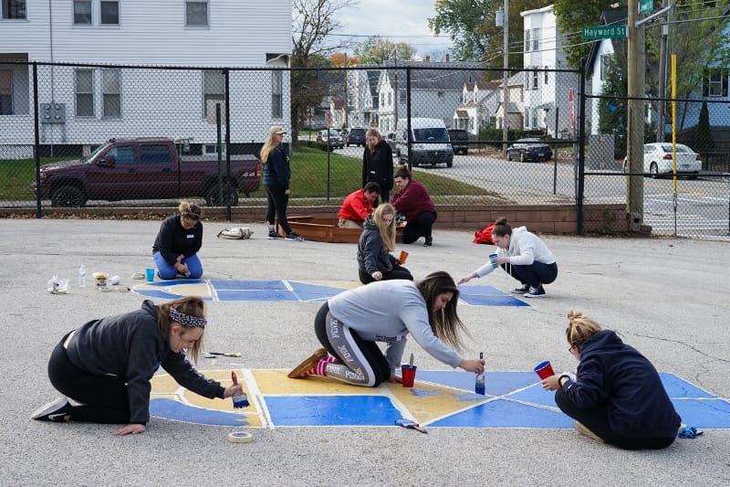 SNHU Inter-Greek Council joins City Year NH volunteers for Day of Service at Hallsville  post image