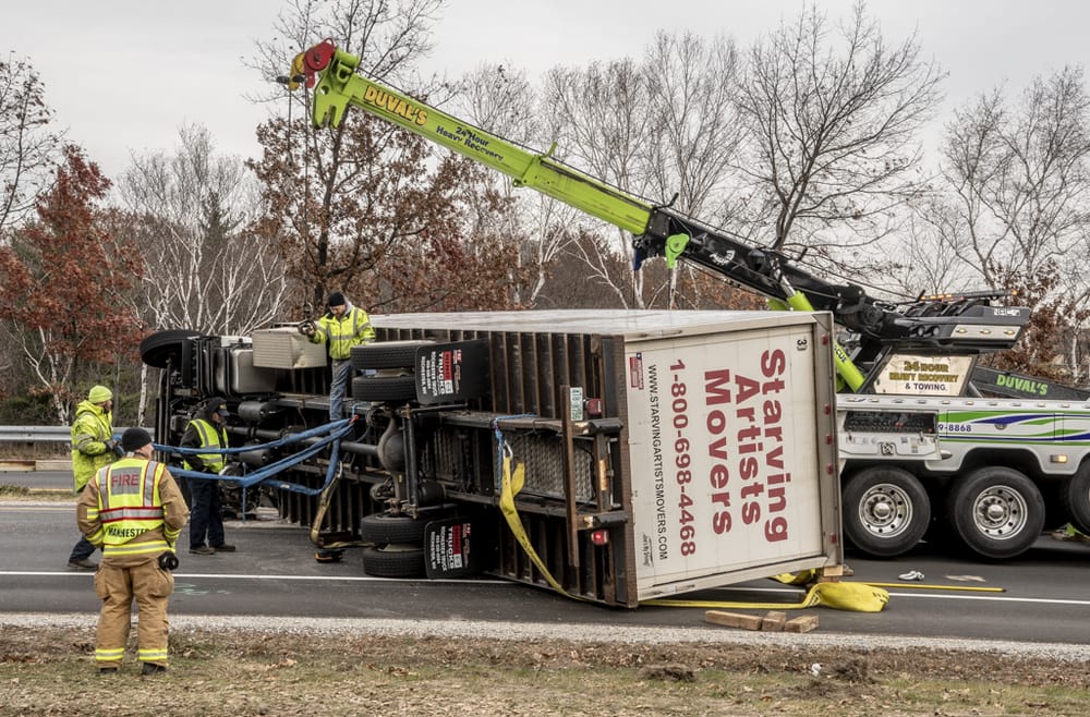 Box truck rollover ties up morning commute on I-293 post image