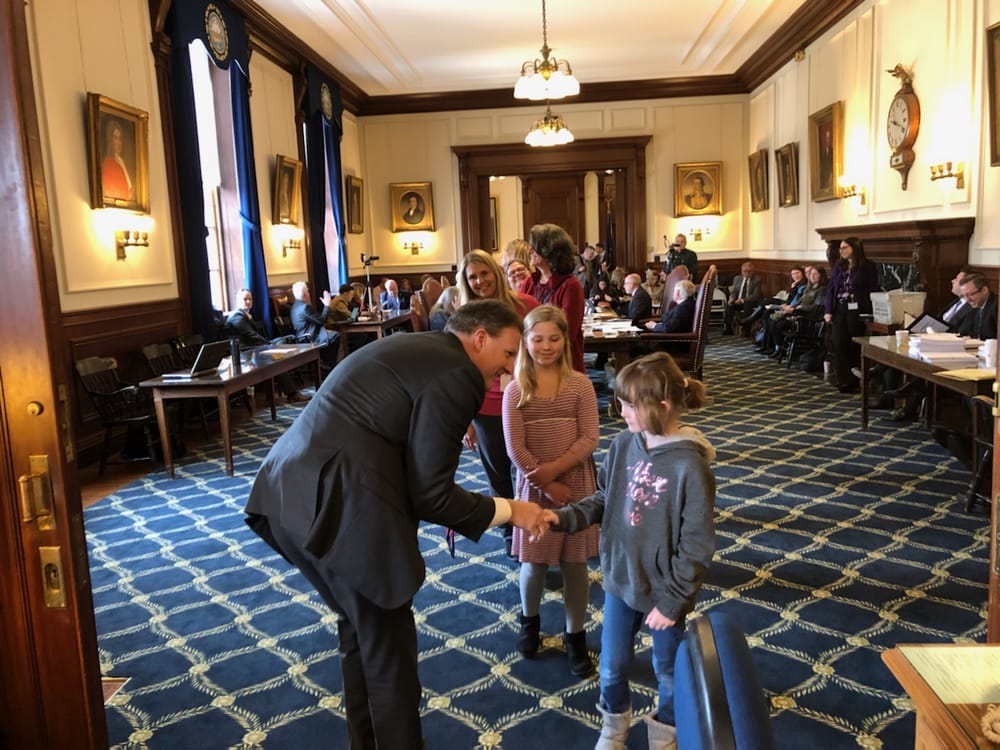 Sununu appoints Eddie Edwards to licensure post, and it’s handshakes as usual – with a pocketful of Purell post image