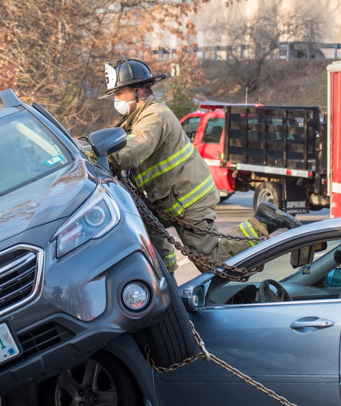 Woman rescued after crash leaves one car on top of another post image