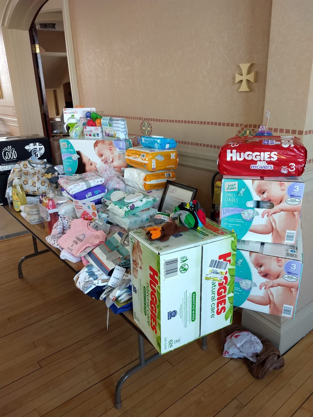 Holy Trinity Cathedral collecting baby items for Mom’s Place, offering palms for Palm Sunday post image