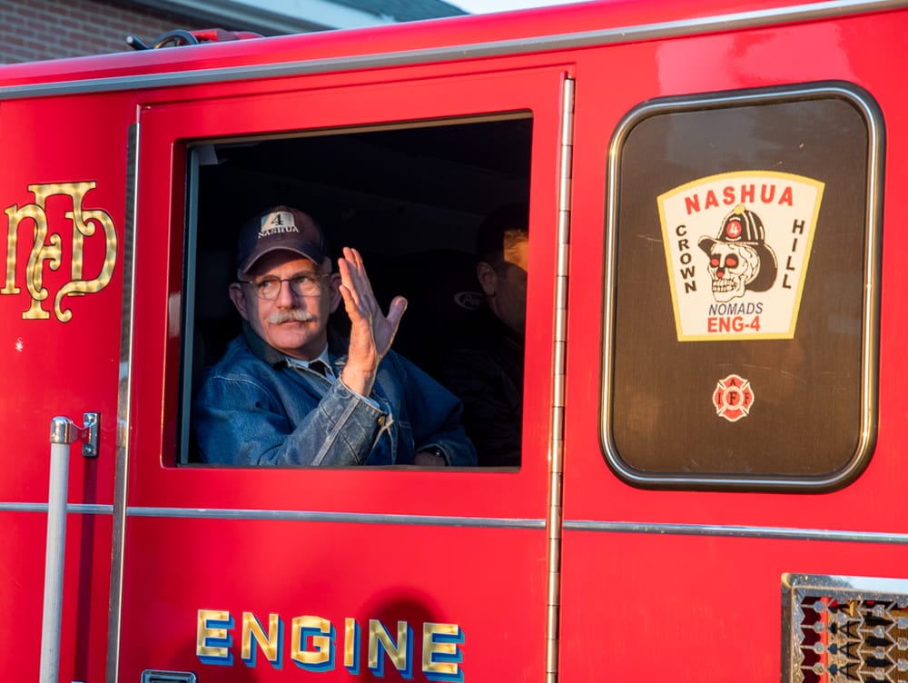 End of an era for retiring Nashua Fire Chief Rhodes, who was driven home in the same engine he started with post image
