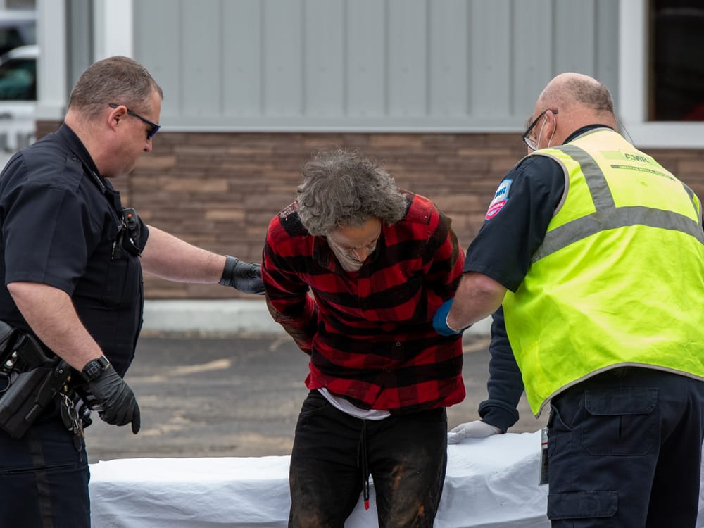 Bedford police charge river-jumper as March purse-snatcher who got away on moped post image