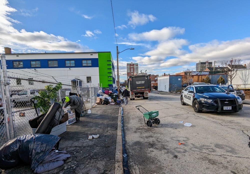 Packing up: City workers, police on site at encampment to enforce vacate order post image