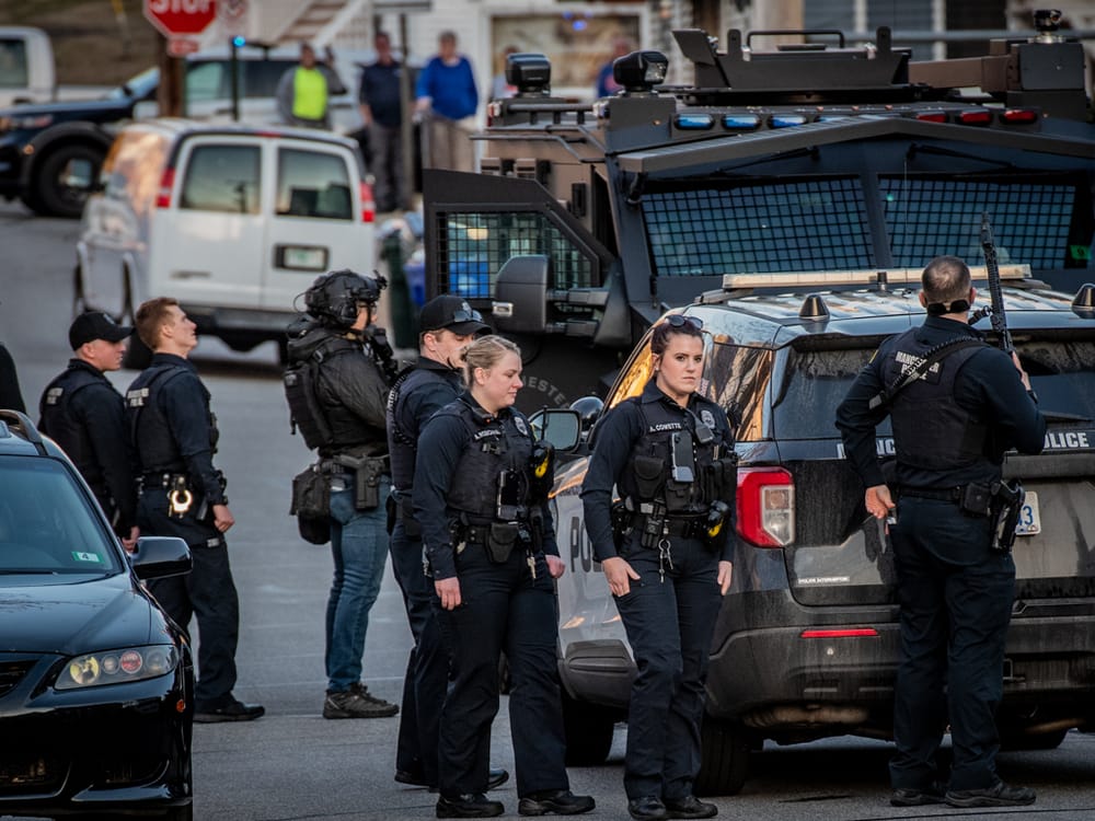 Police surround house on Merrimack Street, 2 people removed from scene in handcuffs post image