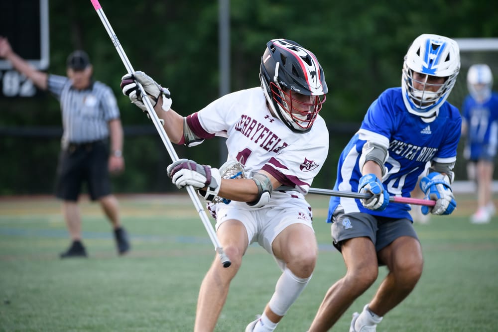 Boys lacrosse: Defending champs advance to semis post image