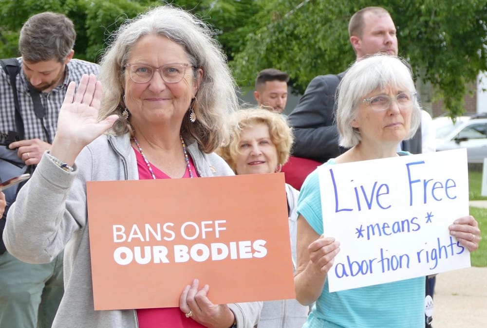 Rally over reproductive rights at State House on anniversary of SCOTUS reversal of Roe v Wade post image