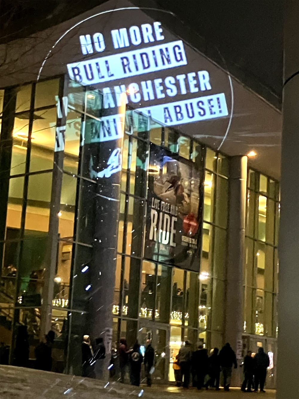 Protesters project anti-bull riding message onto SNHU Arena post image